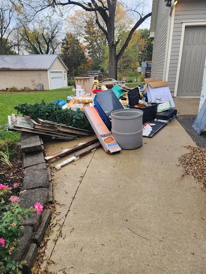 Dumpster being loaded with debris for Residential Dumpster Rental in Cudahy